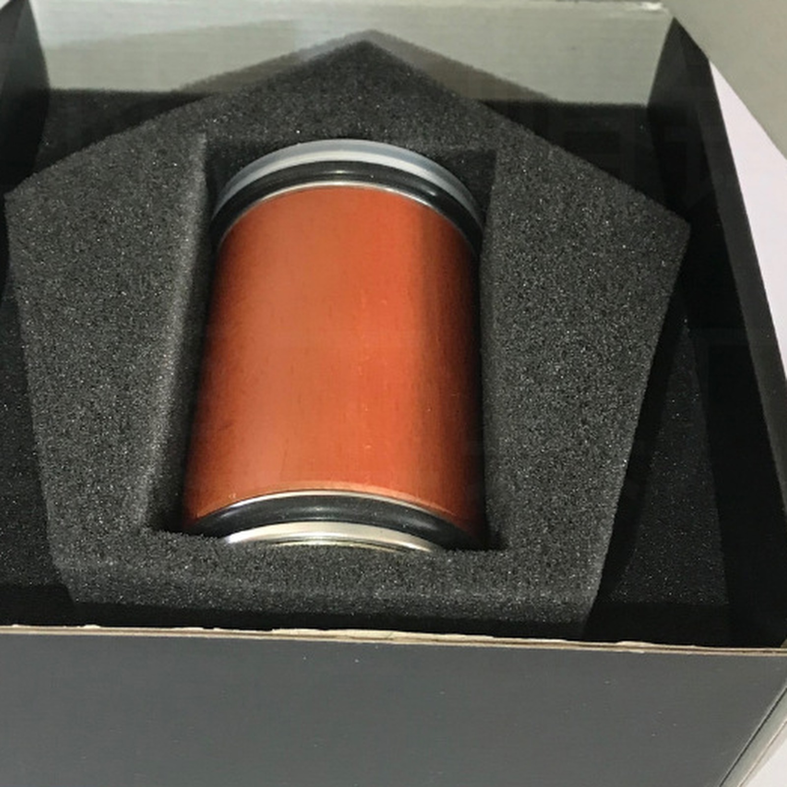 Wood sharpening roller in a fitted insert inside a plain black box